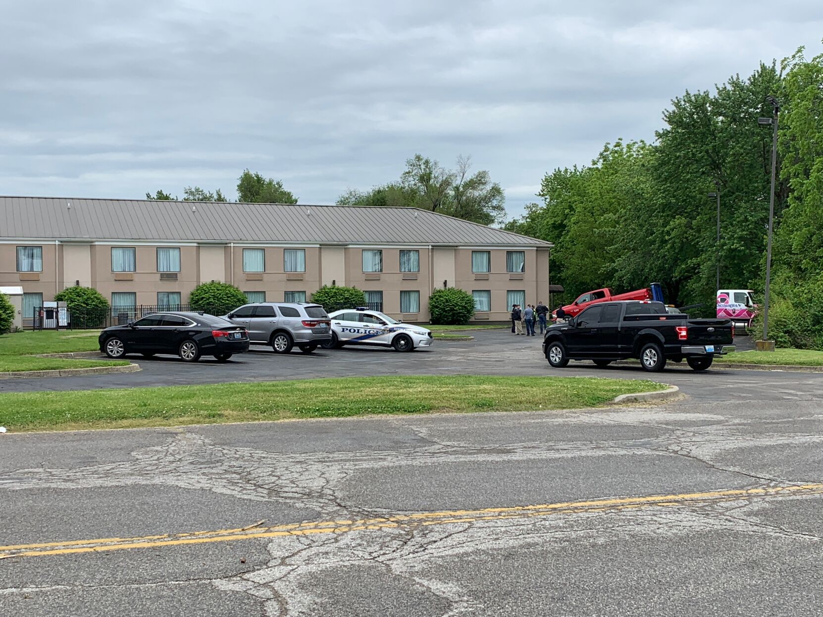 Man, woman found shot to death in truck in hotel parking lot died in murder-suicide, coroner says